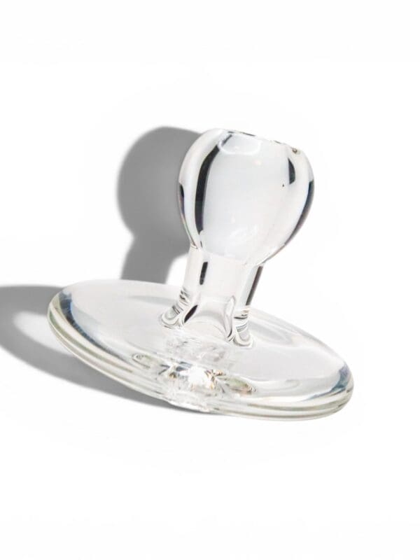 Clear borosilicate glass Terp Trunk directional carb cap with rounded airflow handle.