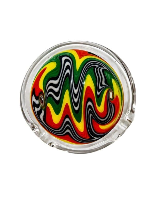 Rasta Wig Wag Glass Pendant with red, yellow, green, black, and white linework encased in clear glass.